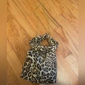 Cheetah print wristlet bag with gold chain strap